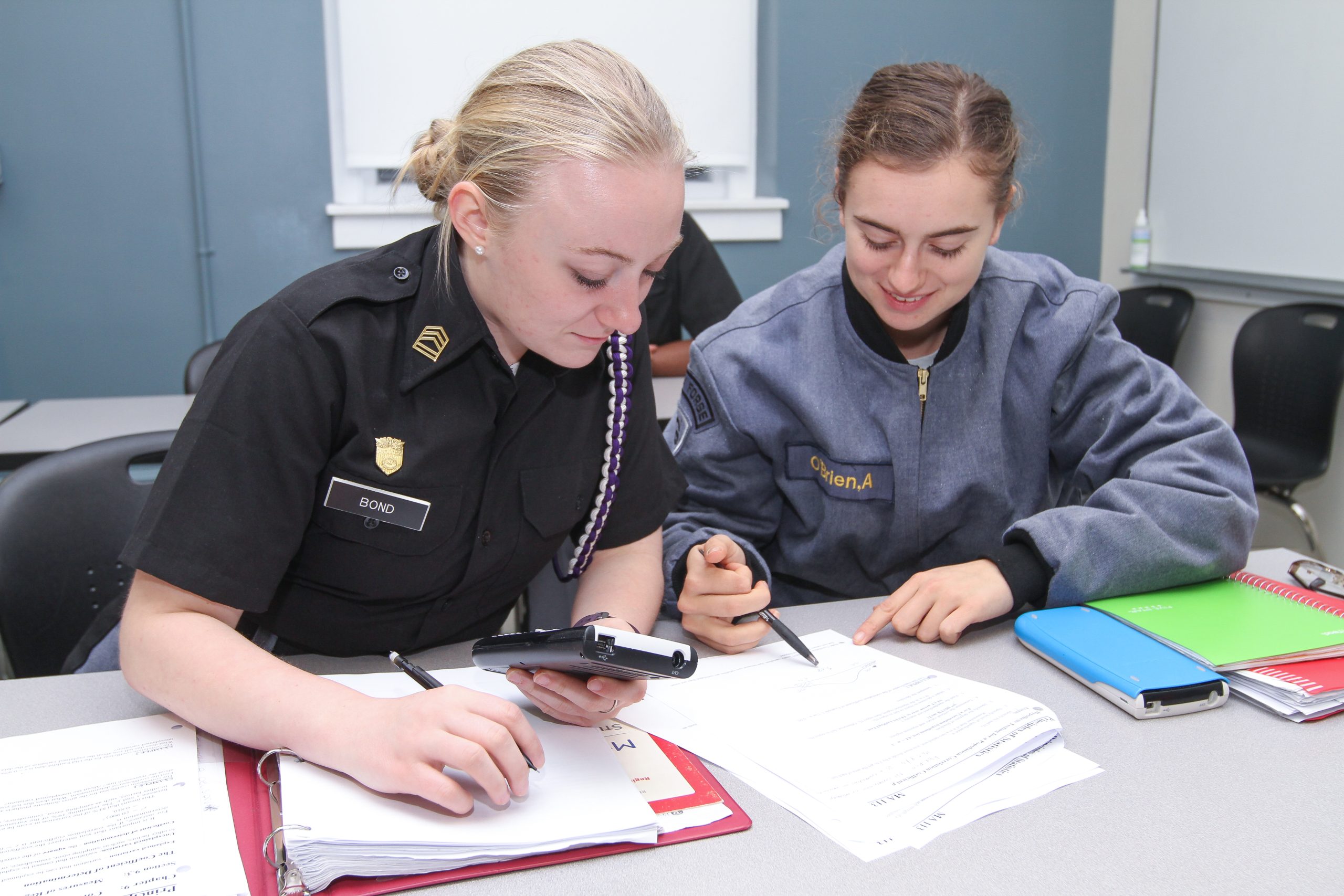 Two VFMC female cadets studying